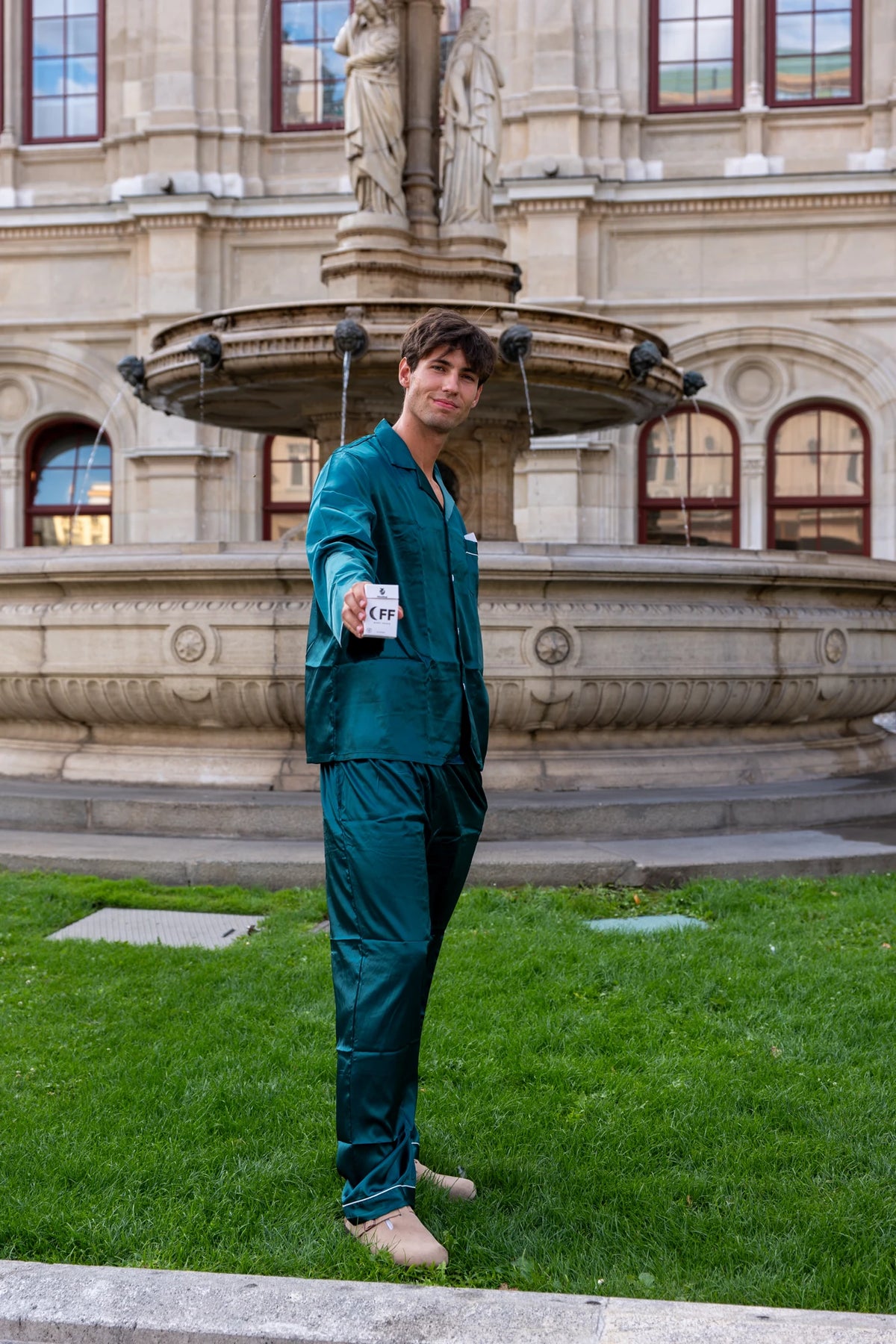 Oli wearing dark green Moodsup Nightwear by the fountain in Vienna